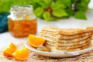 Pancakes with orange jam and fruit