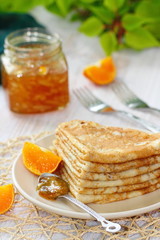 Pancakes with orange jam and fruit