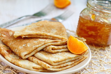 Pancakes with orange jam and fruit