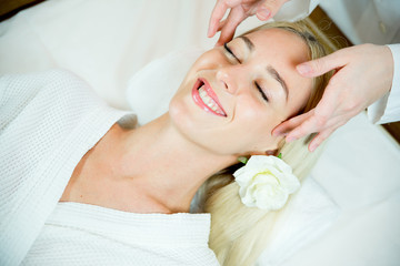 Obraz na płótnie Canvas Girl doing face massage