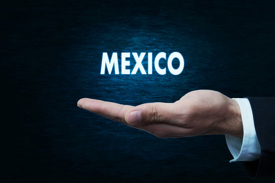 Hand holding word of Mexico