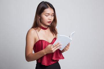 Young Asian woman read a book.