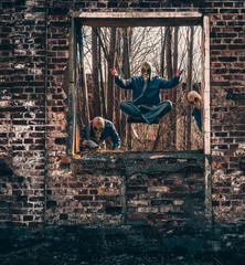 Photo of a man in a gas mask in an old building