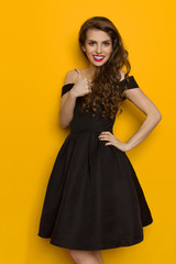 Smiling Elegant Woman In Black Dress Gives Like