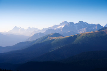 The first rays of the sun illuminate the mountain in the Western Caucasus