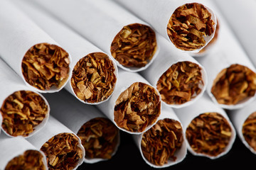 cigarette close up isolated on blak background. Drug addiction. Tobacco smoking. cancer. Nicotine. Bad habit.