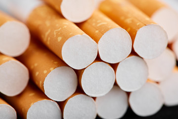 cigarette close up isolated on blak background. Drug addiction. Tobacco smoking. cancer. Nicotine. Bad habit.