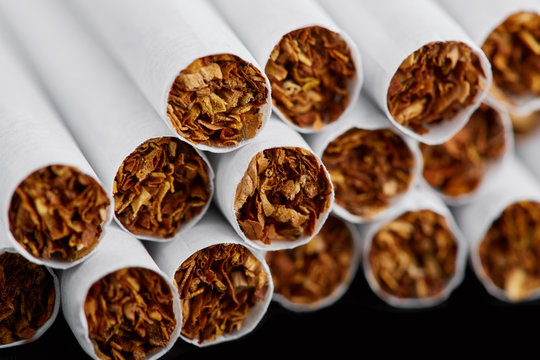 cigarette close up isolated on blak background. Drug addiction. Tobacco smoking. cancer. Nicotine. Bad habit.