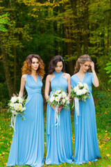 Obraz na płótnie Canvas Three beautiful bridesmaids