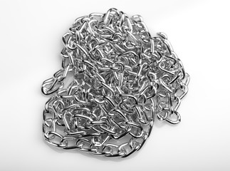 Chain heap - abstract metal background. Collection silver jewelry chains on an isolated black...