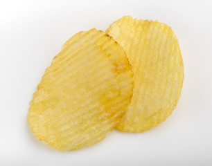Crispy potato chips. Fast Food. Potatoes. Fatty unhealthy foods. corrugated chips