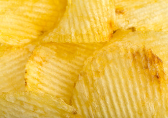 Crispy potato chips. Fast Food. Potatoes. Fatty unhealthy foods. corrugated chips