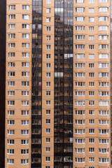 The wall of a multifamily high-rise apartment building in the new district of St. Petersburg