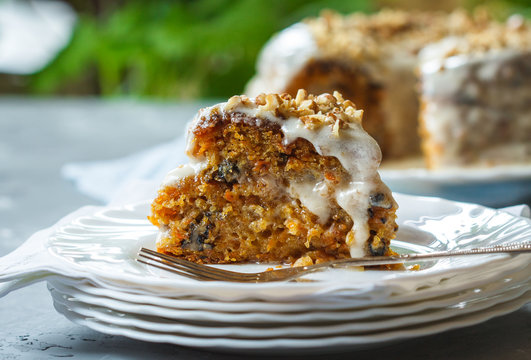 Carrot cake with walnuts, dessert in the garden, selective focus