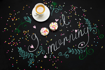 morning spring still life with a m cup of coffee and cakes. Breakfast on Valentine's Day. The drawing on a slate board.