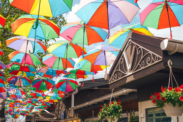 Fototapeta na wymiar A beautiful rooftop, the streets of colorful umbrellas