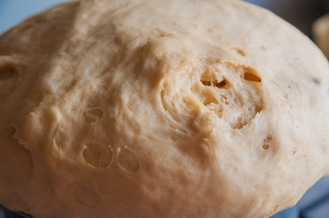 Dough. Dough for pies, bread, cakes, biscuits. Flour product in a black large saucepan