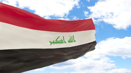 Waving flag of Iraq on the blue cloudy sky.