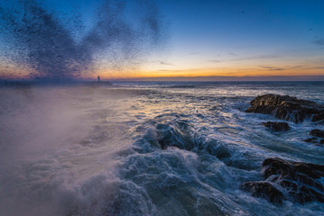 Sunset over Atlantic Ocean. View from breakwater in Porto, Portugal