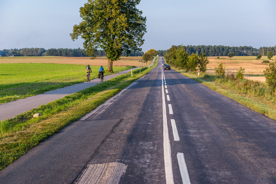 Bicycle path next to road in Pomorskie Region of Poland