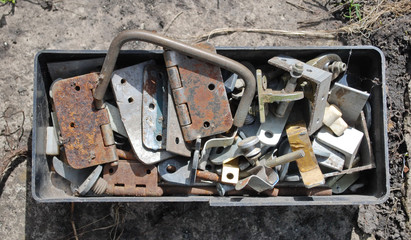 Old rusty nails and screws in a drawer