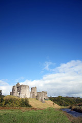 Kidwelly Castle by the River Gwendraeth is a ruin of a 13th century medieval castle and a popular tourist attraction