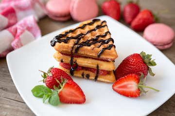 waffles with strawberries and chocolate.