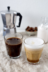 Hot latte and black coffee on white background. Morning concept