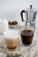 Hot latte and black coffee on white background. Morning concept