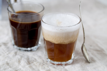 Hot latte and black coffee on white background. Morning concept