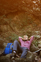 Men sitting in the forest and resting.