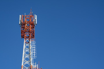 Telecommunication mast TV antennas with blue sky