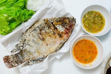 Tilapia fish grilled with Salt  and have Spicy Sauce