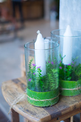 White big candles in glass