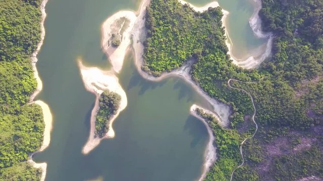 Aerial view over Hong Kong Tai Lam Chung Reservoir under smokey weather
