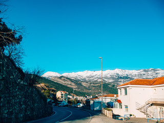 Fototapeta na wymiar Snow-covered mountains of Budva in Montenegro, Adriatic sea