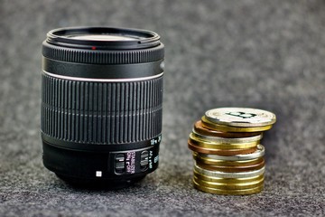 DSLR Camera lens and bitcoin coins