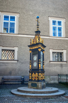 Old street clock. Clock-Barometer in city center of Salzburg, Austria