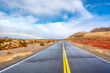 Open highway and rainbow