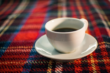 Coffee Cup on Tartan