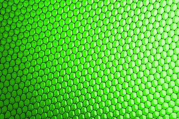 abstract texture honeycomb. Metallic net background or texture. metal mesh. full frame colourful illuminated detail of a metallic grid in front of a loudspeaker