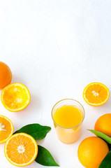 Freshly squeezed orange juice in glass on white background