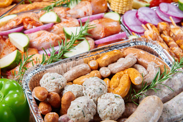 Marinated meat and vegetables prepared for grilling