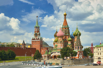 Fototapeta na wymiar View on Moscow Red Square, Kremlin towers, stars and Clock Kuranti, Saint Basil's Cathedral church. Hotel Russia Moscow Red Square Panorama. Moscow holidays vacation tours famous sightseeing points