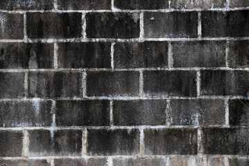 Black stain on white brick concrete wall background