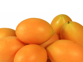 Heap of Vibrant Yellow Fresh Ripe Marian Plums Isolated on White Background 