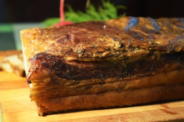 Smoked bacon on wooden table