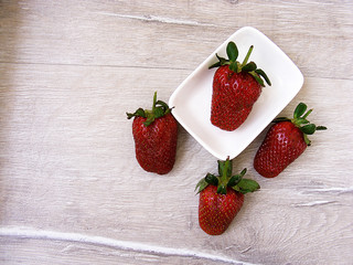 Strawberries on the rustic floor, strawberries in the plate, lovely beautiful strawberry pictures,
