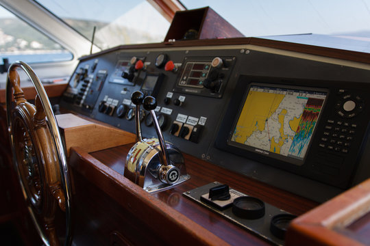 Steering wheel on the bridge of the yacht