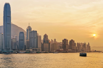 Obraz premium Star ferry at Victoria Harbor in Hong Kong at sundown